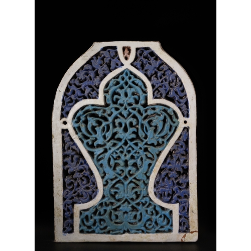 Lot 316 — A Rare Islamic Deeply Carved Dark Blue & Turquoise Tile Panel, Timurid Style, 19th Century